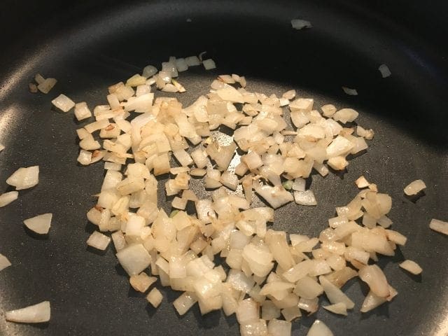 Cook onion until tender for the Ravioli Florentine Soup