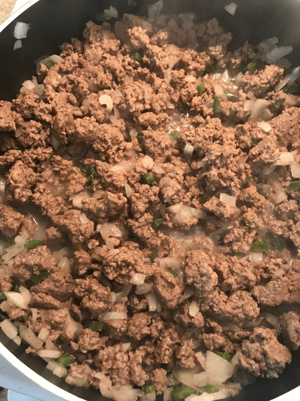 Cooking the beef for delicious beef enchiladas.
