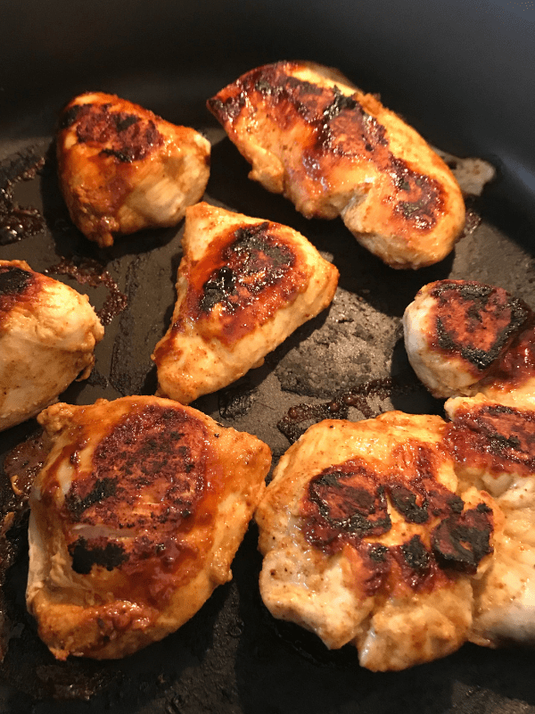 Cook the fajita chicken for the Chicken Fajita Bowls on Meal Planning Mommies
