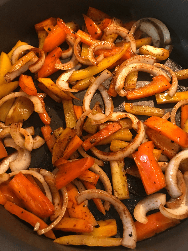 Cook bell peppers and onions in the fajita seasoning.