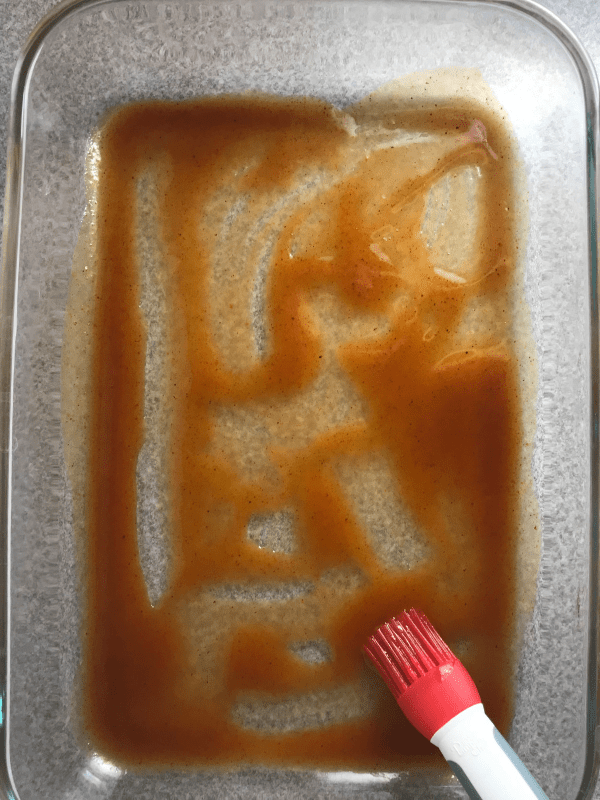 Spread enchilada sauce on the bottom of the pan.