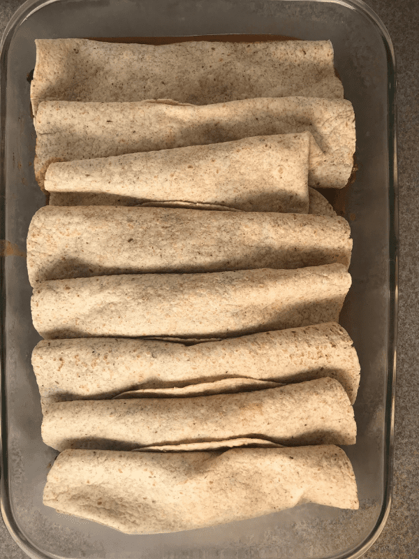 Roll up 2/3 cup meat mixture in flour tortillas and place in baking dish seam side down.