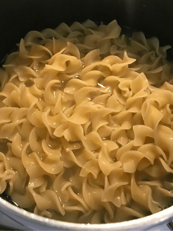 cooking the egg noodles for the ground turkey stroganoff